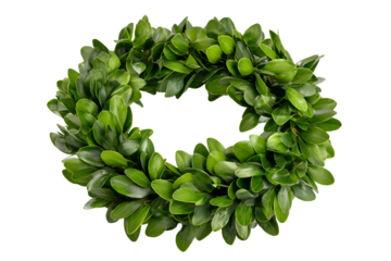 A lush green wreath made of small leaves on a dark background
