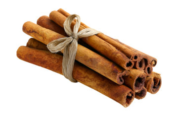 Aromatic cinnamon sticks tied together with twine on a black background