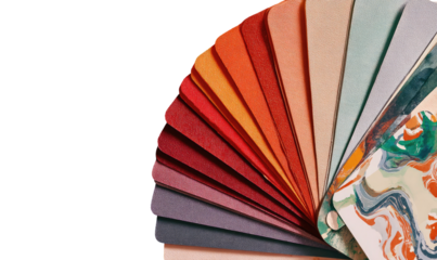 Fan of paper swatches in warm and cool tones, some marbled