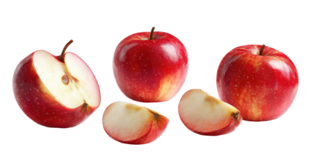 Red apples, one sliced, with two wedges on black background