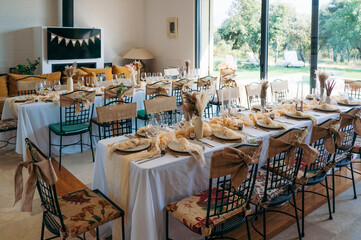Indoor celebration tables decorated with rustic style.