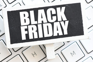 BLACK FRIDAY words on a chalkboard and black background. Time for promotions in salons and online.
