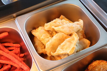 Close-up shot of crispy, golden-brown dumplings, perfect for culinary projects