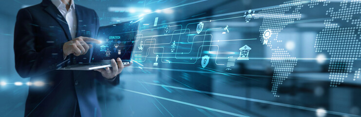 Lawyer using laptop analyzing and development LegalTech platforms. Digital legal services...