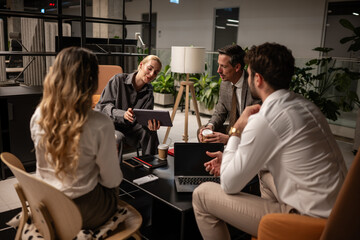 Business partners collaborating in modern office lounge area
