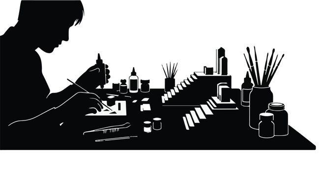 Focused individual meticulously assembling a detailed miniature model with precision tools and paints.