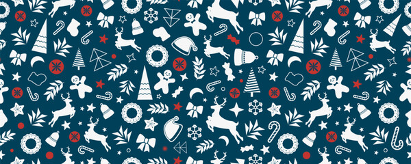 Christmas seamless pattern with holiday elements. Reindeer, stars, trees, and sweets in festive winter composition on blue background © stas111