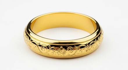 Elegant gold ring with intricate scrollwork engraving, showcasing timeless beauty and fine craftsmanship. Golden band on a pristine white background, ideal for luxury jewelry