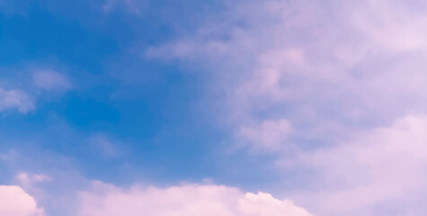 Vibrant Pink Sunset Sky with cumulus clouds and blue gradient. This Pink Sunset Sky photo is ideal for dream, twilight, or dramatic nature backdrops.