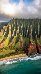 Green cliffs and turquoise sea coastline under bright daylight aerial view