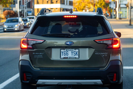 Canada, 11 October 2025 : Subaru Outback with Quebec license plate stopped at city intersection.