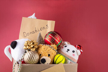 Tradition holiday toys drive, cardboard box full with with kids toys and gifts