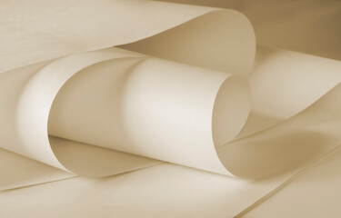 Long sheets of paper from a roll in a warm ochre tone.