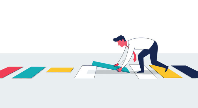 A dedicated businessman systematically constructs a colorful pathway by placing a turquoise block, illustrating the concepts of planning, strategy, and advancement.