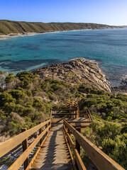 Long, steep wooden stairs leading to beautiful rocky shoreline.  Observatory Beach, Esperance, Western Australia.