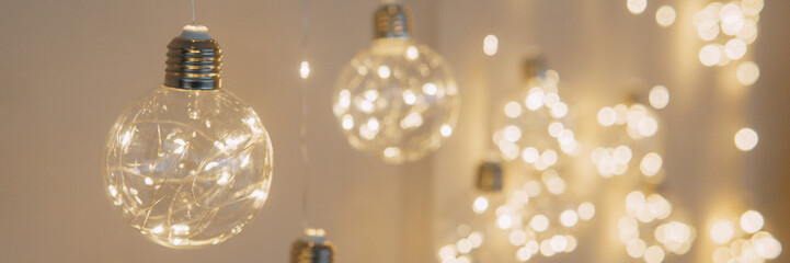 Christmas garland in the form of glowing bulbs. Interior decoration for new year's holidays.