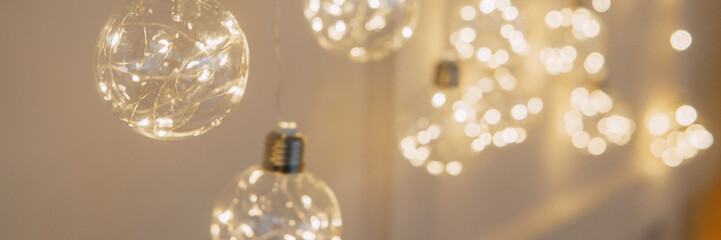 Christmas garland in the form of glowing bulbs. Interior decoration for new year's holidays.