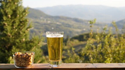 Golden Hour Enjoyment: Cold Beer and Salty Snacks