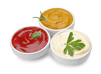 Different sauces and herbs isolated on white