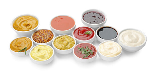 Different sauces and herbs isolated on white