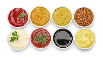 Different sauces and herbs isolated on white, top view