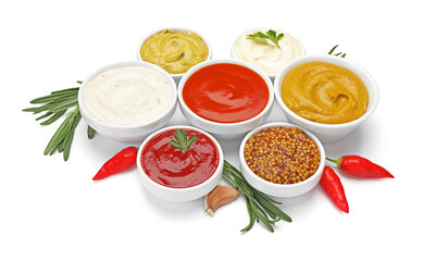 Different sauces and herbs isolated on white