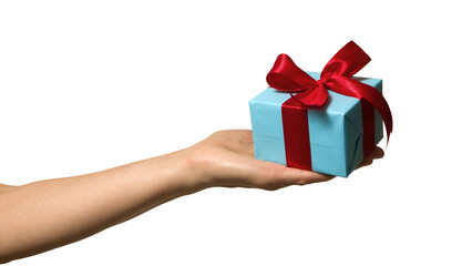 High quality PNG of close up hand with gift box is wrapped in light blue paper and tied with a red ribbon with a bow. Isolated image on a transparent background