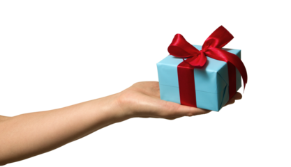 High quality PNG of close up hand with gift box is wrapped in light blue paper and tied with a red ribbon with a bow. Isolated image on a transparent background