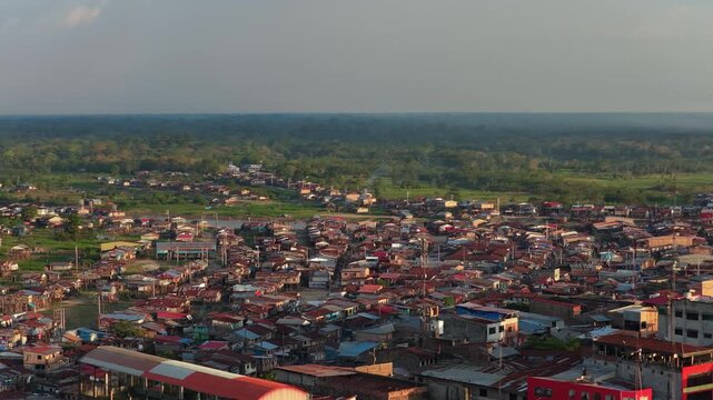 Aerial perspective of Iquitos, a vibrant city nestled in the heart of the vast and lush Amazon rainforest in Peru at sunset