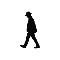 Silhouette of a man in a hat walking