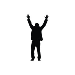 Silhouette of a person with arms raised in celebration or surrender