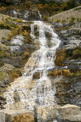 Picturesque high mountain waterfall in the Sopeliana ravine in Bujaruelo