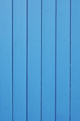 wooden door background with vertical boards and blue paint
