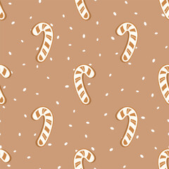Seamless vector pattern with candy cane on a beige background, suitable for Christmas wrapping paper, fabric, and festive packaging
