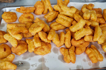 Crispy Deep-Fried Dough Stacked at a Street Vendor 