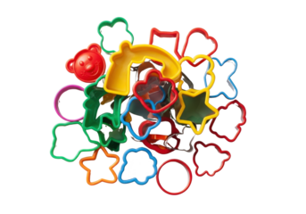 A pile of assorted colorful plastic cookie cutters in various shapes like stars, animals, and hearts. Ideal for children's baking activities.