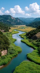 Serene River Winding Through Lush Green Valley Under a Blue Sky with Fluffy White Clouds and Rocky Hills in the Distance