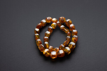 Natural Baltic amber necklace on dark background