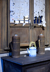 Thermos flasks and ceramic teapots once used by Chinese households.