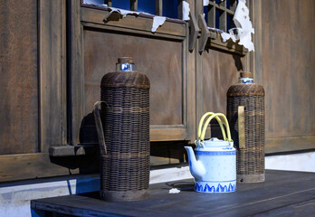 Thermos flasks and ceramic teapots once used by Chinese households