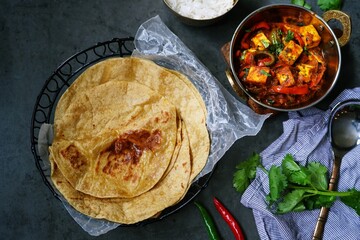 Homemade Paneer Jalfrezi served with fresh roti or Chapati, selective focus
