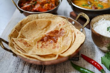 Indian vegetarian meal - Roti served with dal tadka paneer jalfrezi and rice