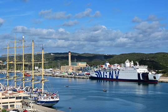 Ma&oacute;, Mah&oacute;n, Menorca, Balearic Islands, Spain, Europe - 10.2025 :  Maritime station, Royal Clipper 5-masted sailing ship, Grandi Navi Veloci - Golden Bridge ship, CEMEX cement plant, Mediterranean Sea