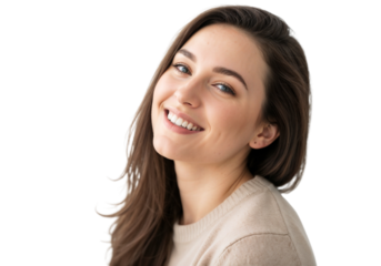 Smiling young woman with long hair poses against a plain background in a light sweater