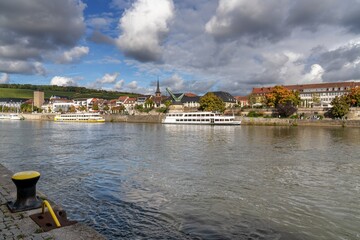 view of the Mainz River and river cruise ships with the historic old town of Wurzburg in the background