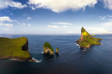 sea stacks and islets in the Norwegian Sea off the coast of Vagar island in the Faroe Islands