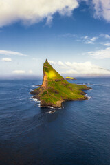 vertical view of Tindholmur Islet off the coast of Vagar Island in the Faroe Islands