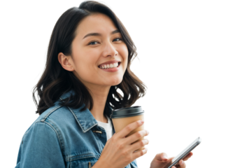 Smiling woman holding coffee cup and smartphone indoors with bright background