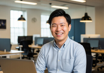 Fototapeta premium Smiling asian man entrepreneur in modern office excited about career opportunities creative workplace environment portrait