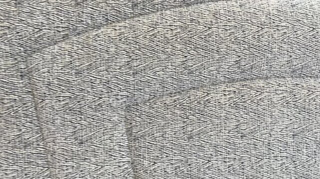 Close up textured sofa fabric surface with detailed upholstery pattern